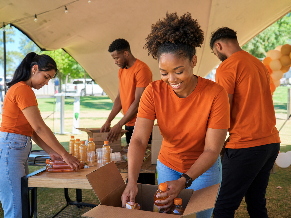 Campaign activation crew wearing orange promotional T-shirts